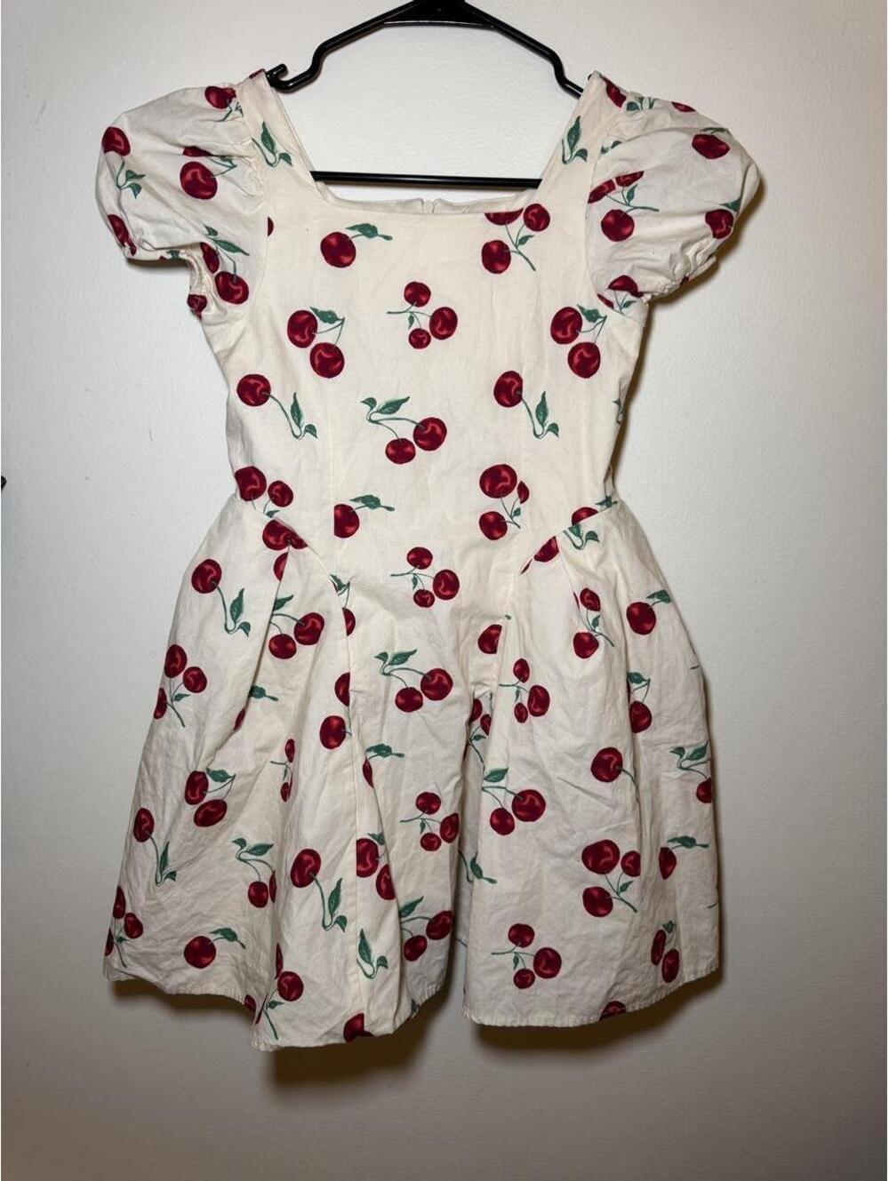 Daisylane cherry print playsuit with red cherries and green stems on cream